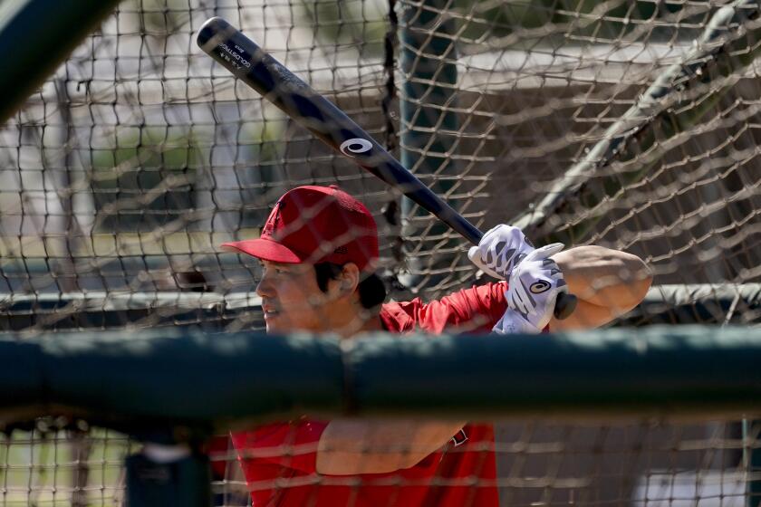 Los Angeles Angels' Shohei Ohtani hits during the teams' spring training baseball workouts, Monday, March 14, 2022, in Tempe, Ariz. (AP Photo/Matt York)