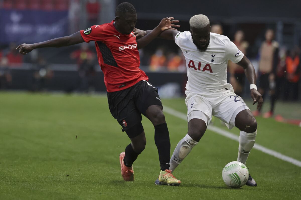Rennes' Hamari Traore, left, challenges the ball to Tottenham's Tanguy Ndombele during the Europa Conference League Group G soccer match Rennes against Tottenham at the Roazhon Park stadium in Rennes, western France, Thursday, Sept.16, 2021. (AP Photo/Jeremias Gonzalez)