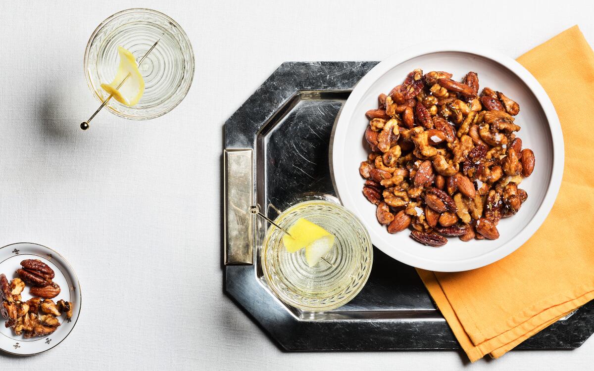 Maple syrup, chile flakes and rosemary flavor these roasted nuts perfect for serving with cocktails during the holidays.