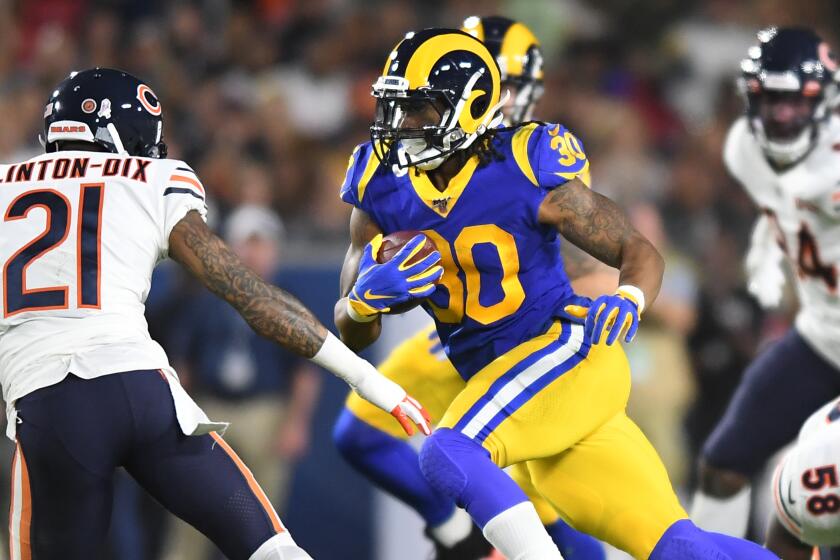 LOS ANGELES, NOVEMBER 17, 2019-Rams running back Todd Gurley picks up yards against the Bears in the 1st quarter. at the Coliseum Sunday. (Wally Skalij/Los Angerles Times)