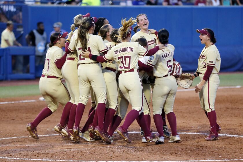 Florida State celebrates after a win over Tennessee after an NCAA softball Women's College World Series game Monday, June 5, 2023, in Oklahoma City. (AP Photo/Nate Billings)