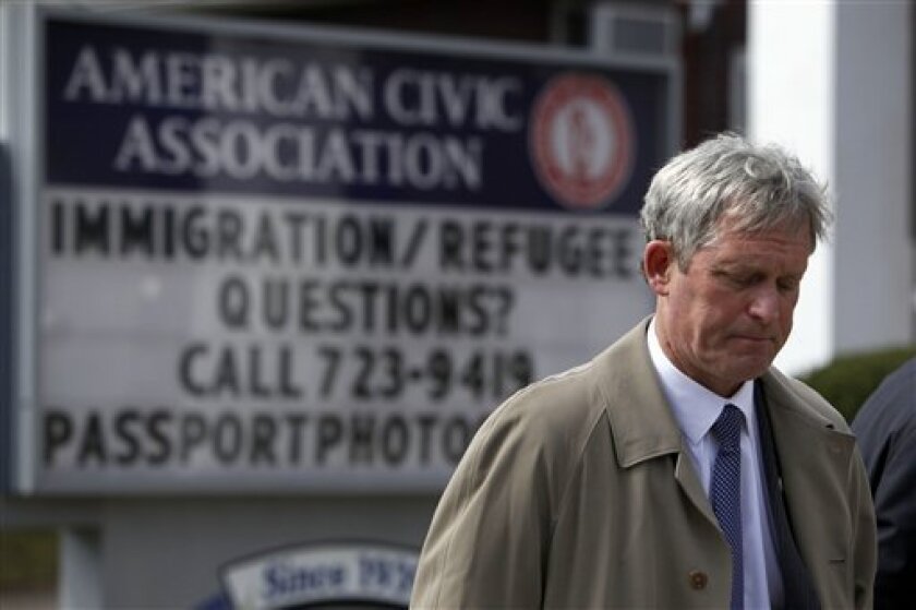Binghamton Mayor Matthew Ryan is seen in front of the American Civic Association in Binghamton, N.Y., Sunday, April 5, 2009. A gunman barricaded the back door of the community center with his car and then opened fire on a room full of immigrants taking a citizenship class Friday, killing 13 people before apparently committing suicide, officials said. (AP Photo/Matt Rourke)