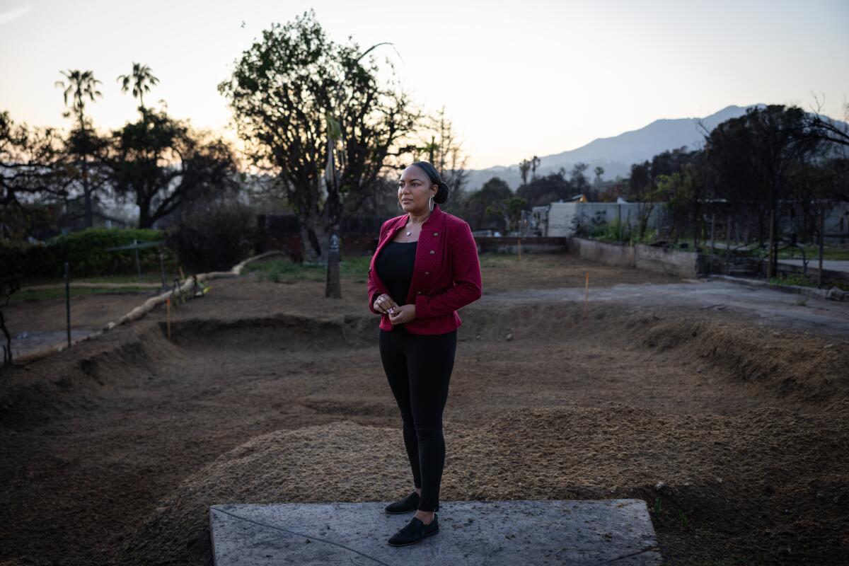 Eshele Williams atthe burned lot where her home, destroyed in the Eaton fire, once stood.