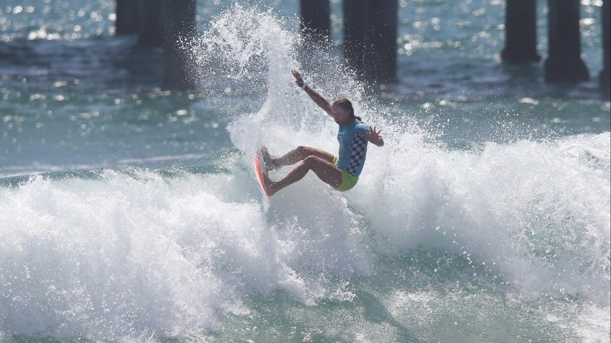 Courtney Conlogue banks off the top of a wave in the final against Stephanie Gilmore at the U.S. Open of Surfing in Huntington Beach on Aug. 5, 2018.