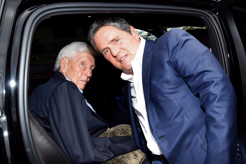 Viacom controlling shareholder Sumner Redstone, left, and Paramount CEO Brad Grey at a movie premiere in 2014.