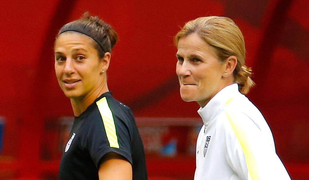 Carli Lloyd, left, and Jill Ellis take part in a training session before the FIFA Women's World Cup Final on July 4.