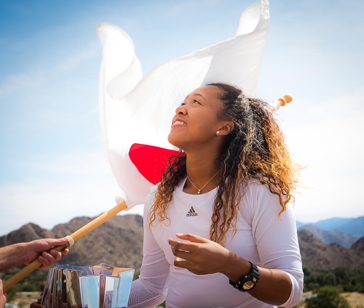 Naomi Osaka of Japan poses with the winner's trophy at the 2018 BNP Paribas Open in Indian Wells, Calif.