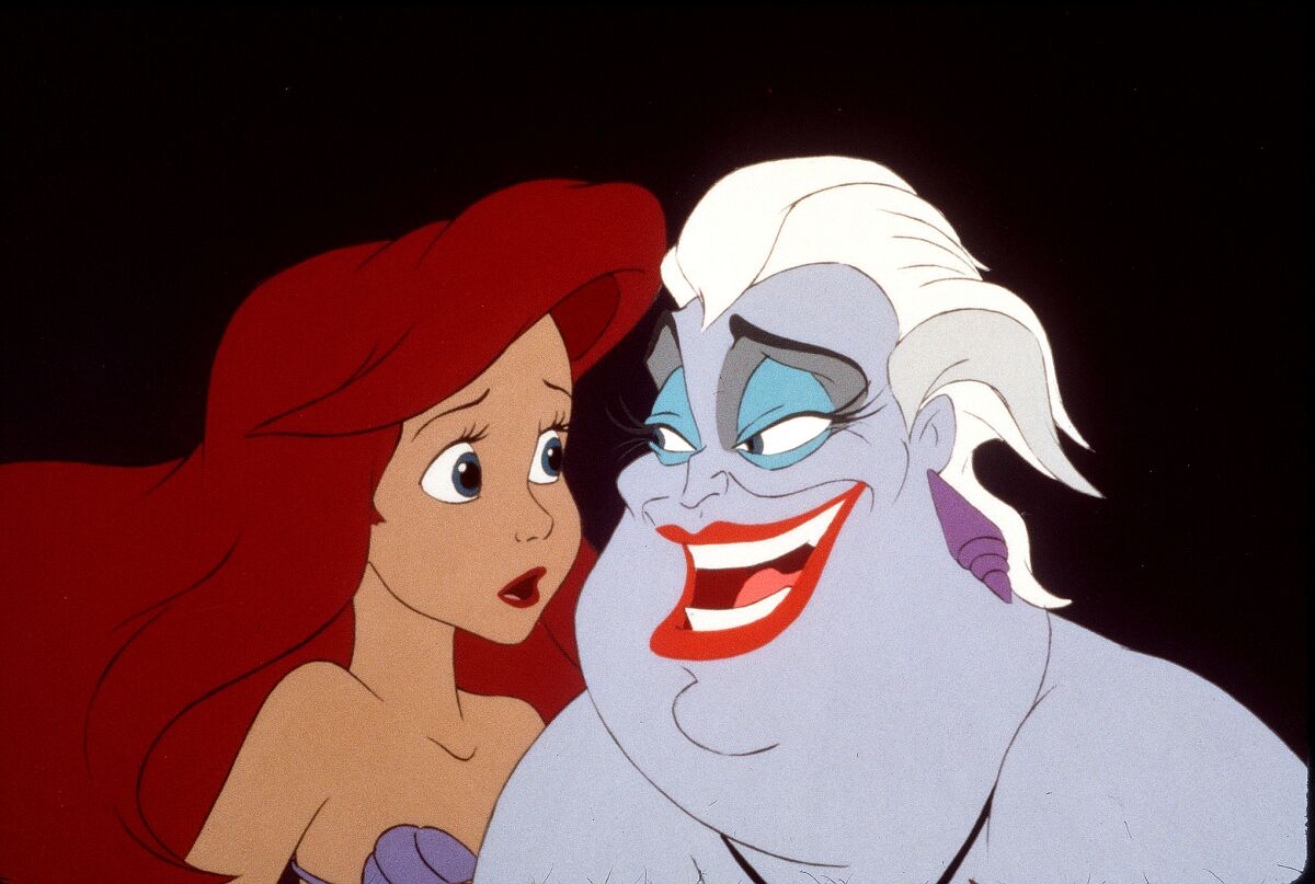 A redheaded mermaid and a grinning sea witch
