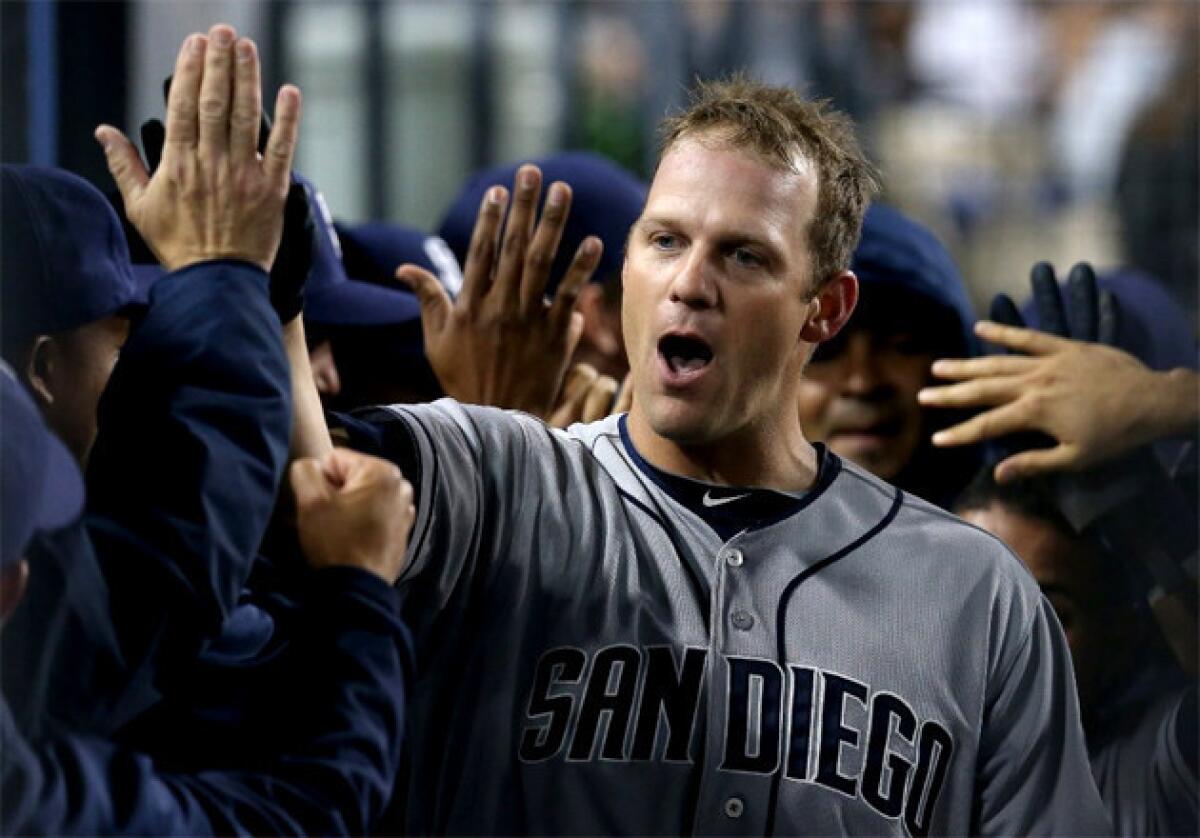 San Diego Padres pitcher Eric Stults celebrates after hitting a three-run homer against the Dodgers.