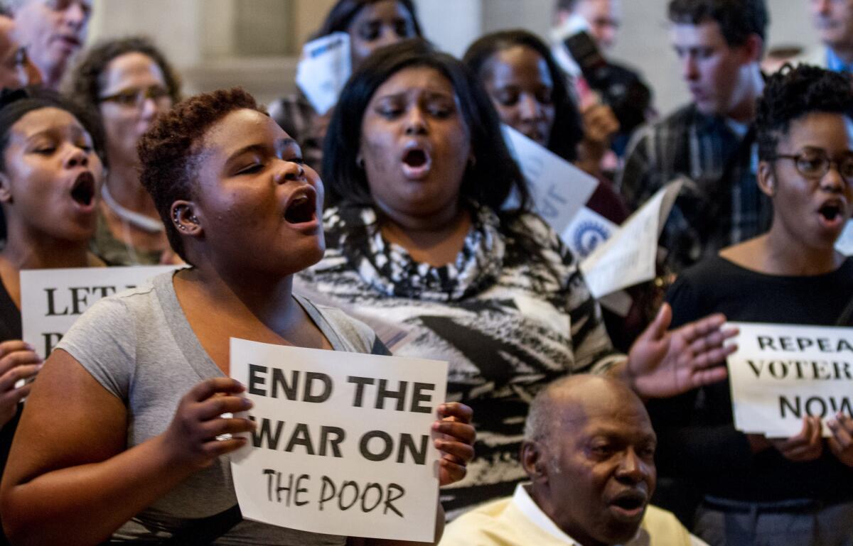 Activists protest outside the House chamber in Nashville last month about issues including voter ID laws.