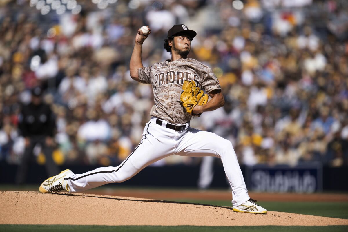 San Diego Padres starting pitcher Yu Darvish delivers during the first inning of a baseball game against the Atlanta Braves in San Diego, Sunday, April 17, 2022. (AP Photo/Kyusung Gong)