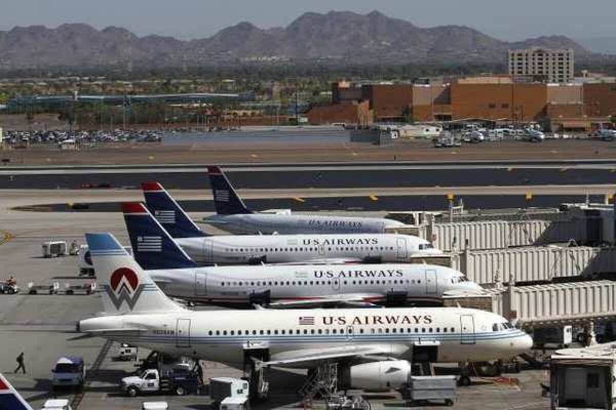 US Airways apologized for sending out a tweet that included a pornographic photo.