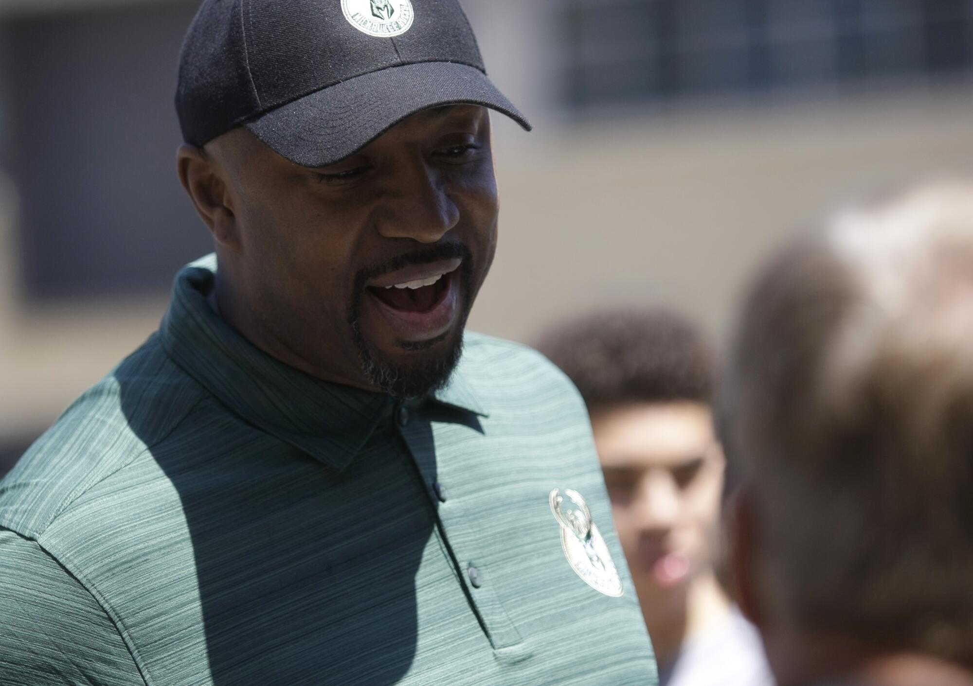 Former Bucks player Vin Baker talks to fans at a summer block party in 2015.