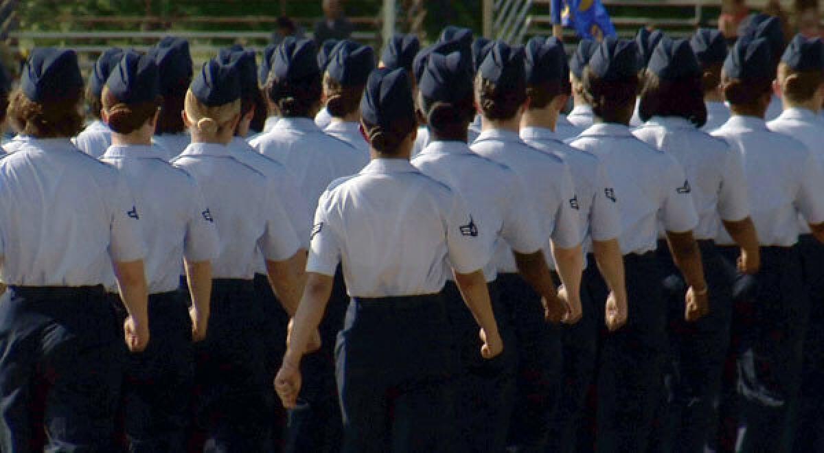 Female trainees march during graduation at Lackland Air Force Base in San Antonio, where a sex scandal continues to unfold.