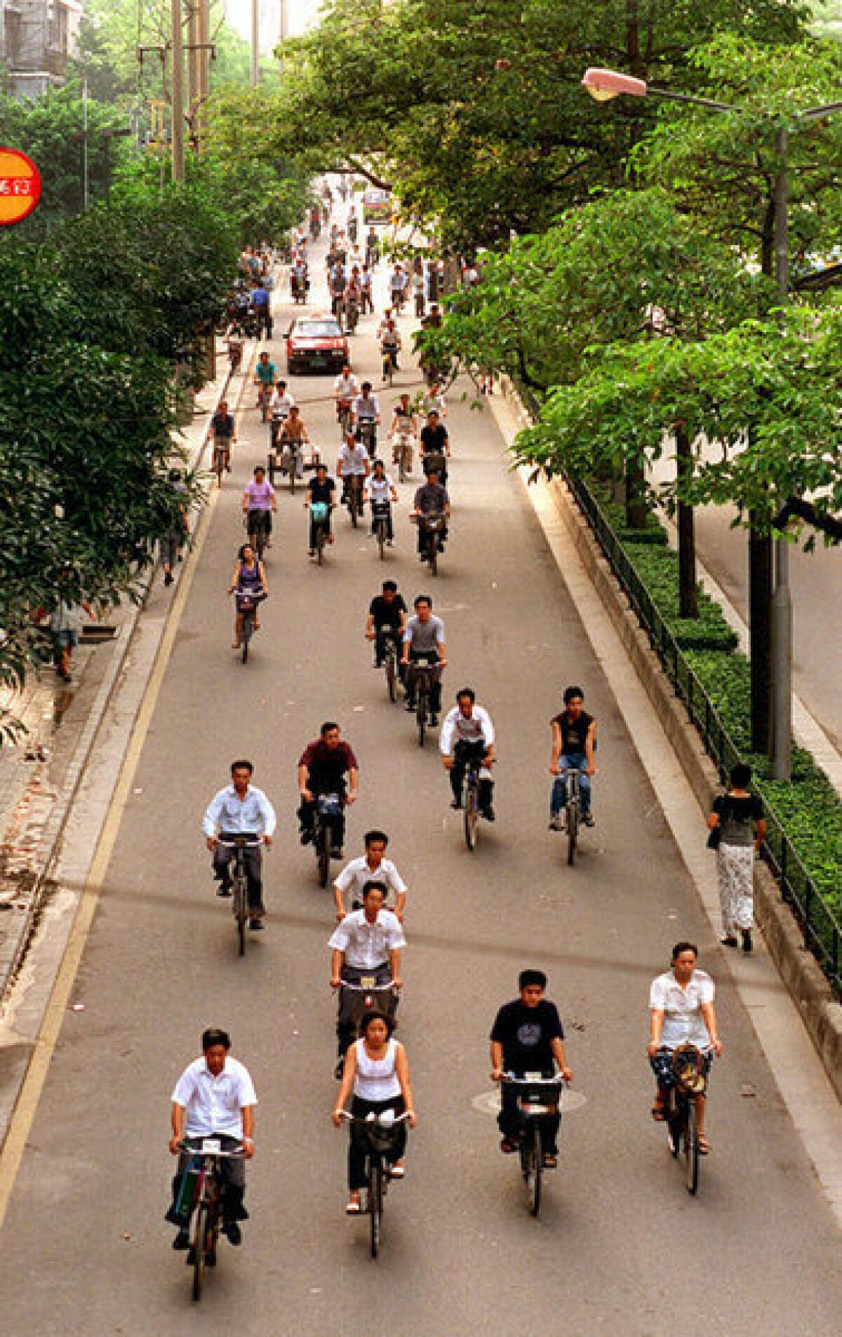 Morning bicycle traffic in Guangzhou, Guangdong Province, China.