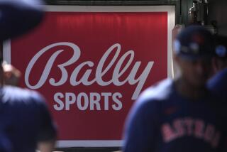 A Bally Sports sign hangs in a dugout before the start of a spring training baseball game between the St. Louis Cardinals and Houston Astros Thursday, March 2, 2023, in Jupiter, Fla. (AP Photo/Jeff Roberson)