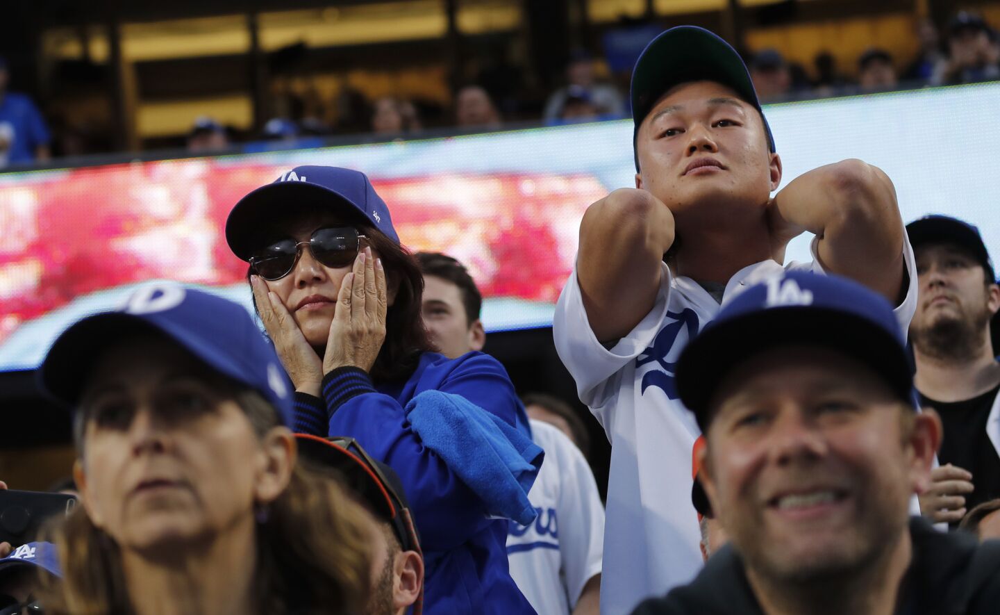 Dodgers fans show concern as the Astros score twice in the first inning of Game 7.