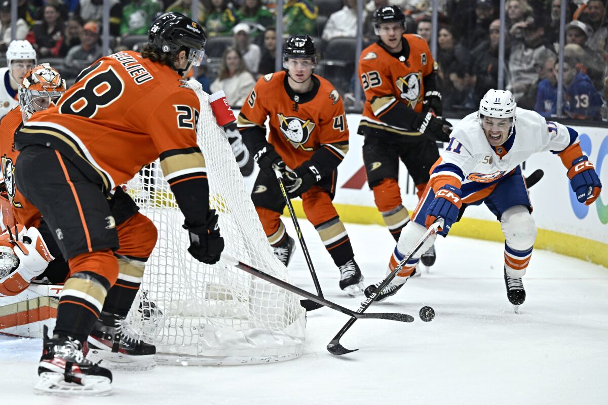 New York Islanders left wing Zach Parise vies for the puck against Ducks defenseman Nathan Beaulieu.
