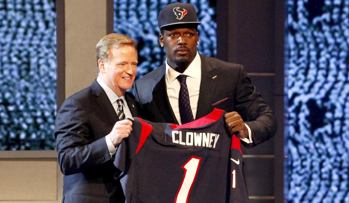 NFL Commissioner Roger Goodell poses with No. 1 overall draft pick Jadeveon Clowney, a defensive end from South Carolina who was selected by the Houston Texans.