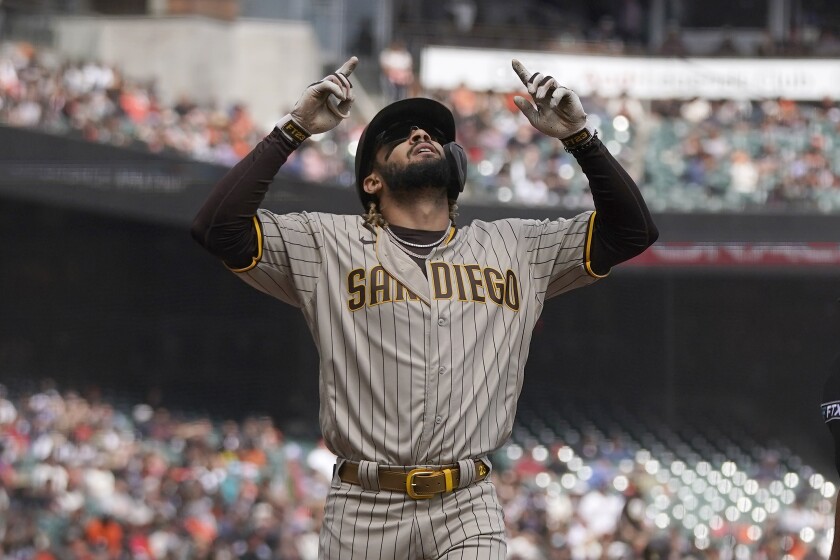 San Diego Padres' Fernando Tatis Jr. celebrates after hitting a home run against the San Francisco Giants during the third inning of a baseball game in San Francisco, Thursday, Sept. 16, 2021. (AP Photo/Jeff Chiu)
