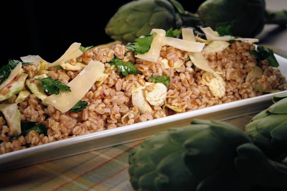 Artichoke and farro salad is topped with Parmigiano-Reggiano.