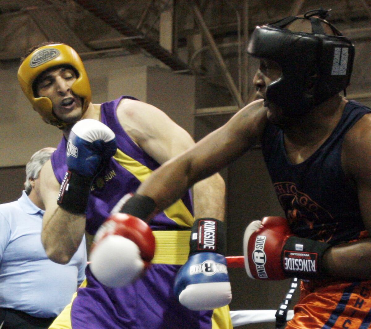 In this May 4, 2009 photo, Tamerlan Tsarnaev, left, fights during the 2009 Golden Gloves National Boxing Tournament.