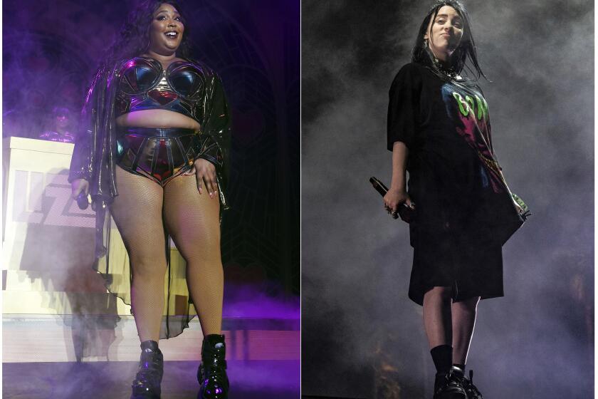 This combination photo shows Lizzo performing at The Hollywood Palladium in Los Angeles on Oct. 18, 2019, left, and Billie Eilish performing at the Coachella Music & Arts Festival in Indio, Calif., on April 20, 2019. Eilish and Lizzo will perform at the 2019 American Music Awards, airing live on ABC from the Microsoft Theater in Los Angeles on Nov. 24. (AP Photo)