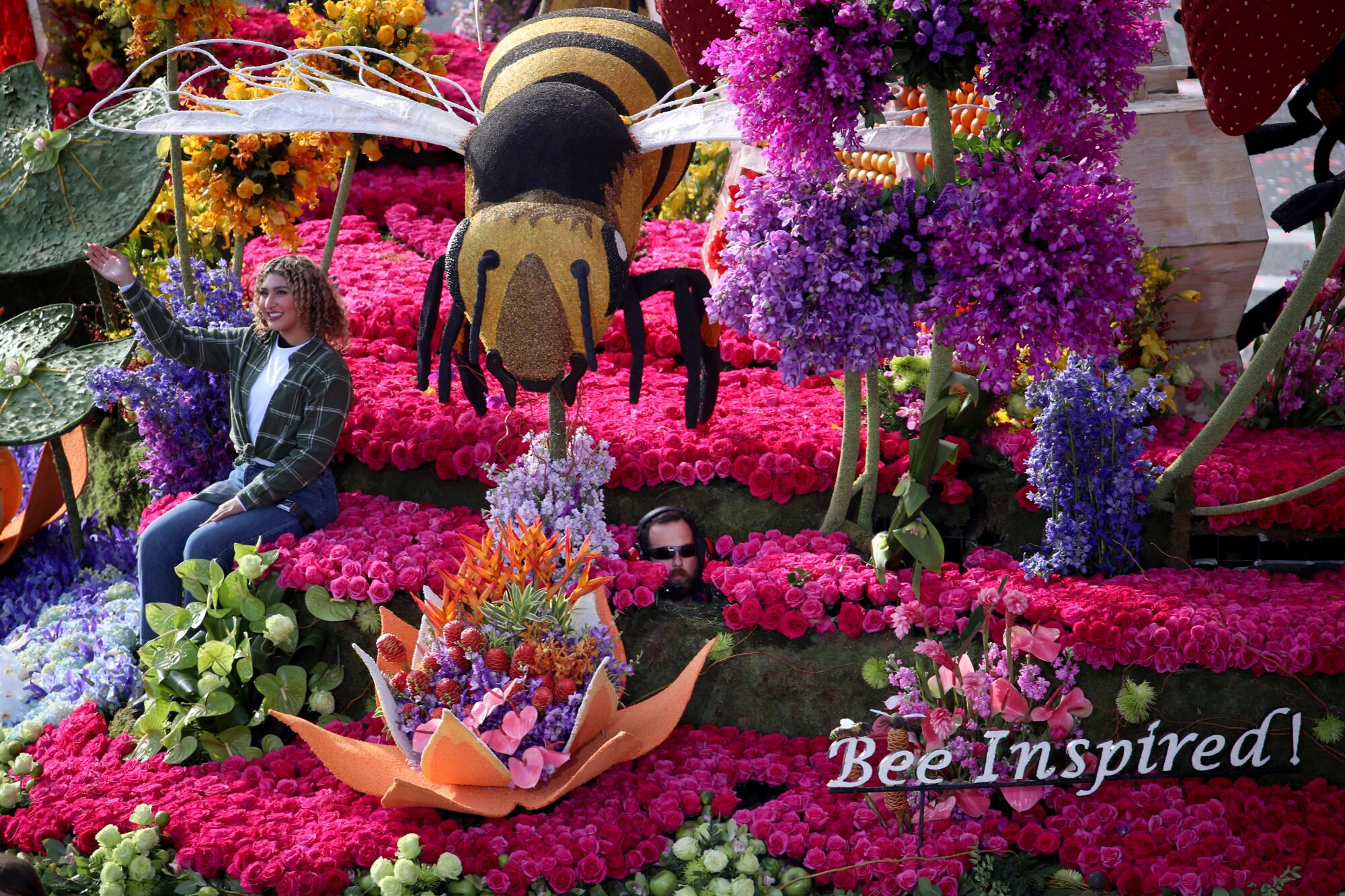 A Rose Parade float features bees and the text "Bee Inspired!"