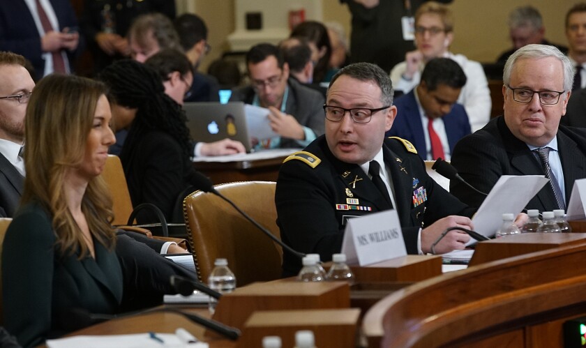 Michael Volkov, right, sits beside his client, Lt. Col. Alexander Vindman, the National Security Council’s top Ukraine expert, during the House Intelligence Committee's impeachment hearings.