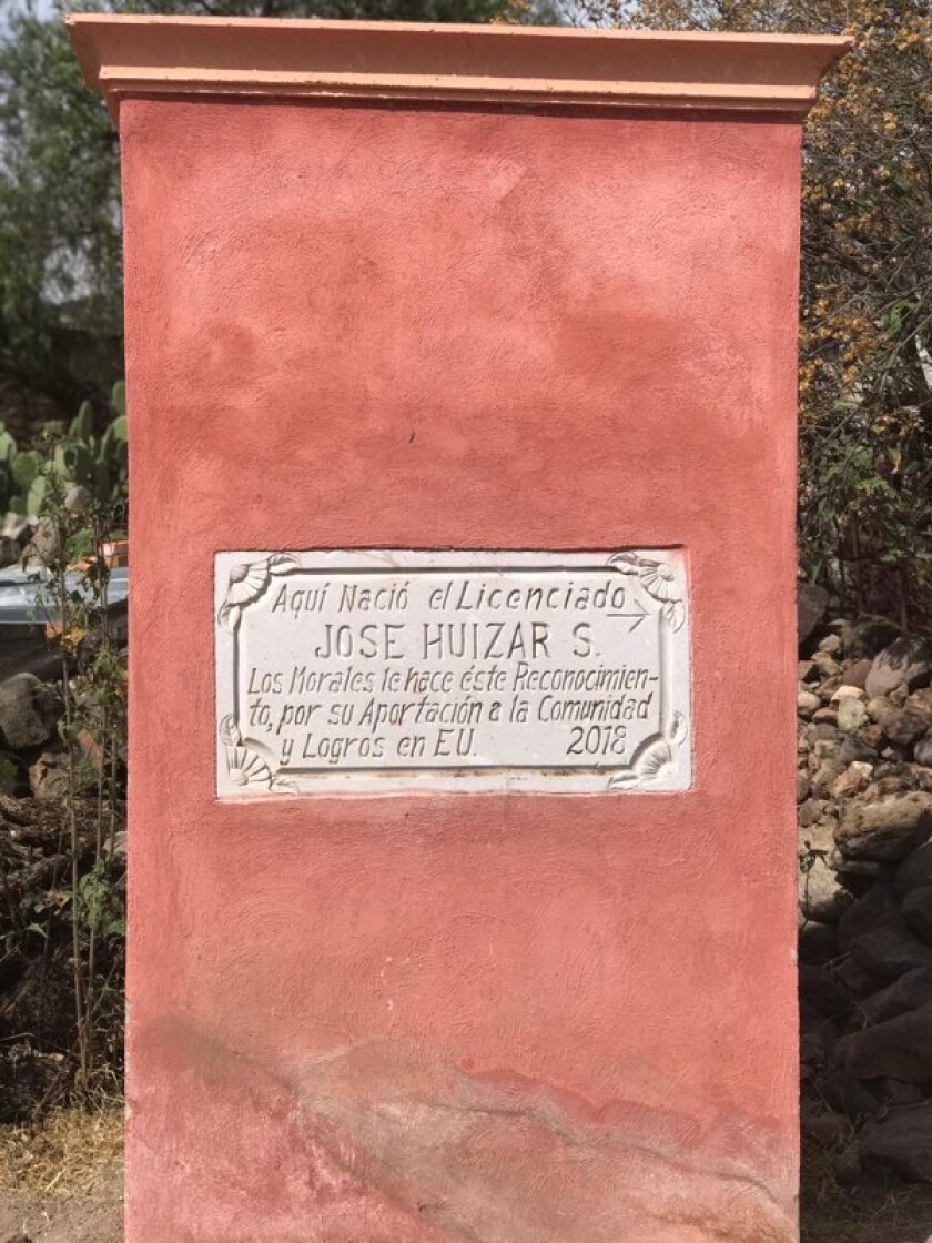 A pillar with a concrete plaque embedded in it