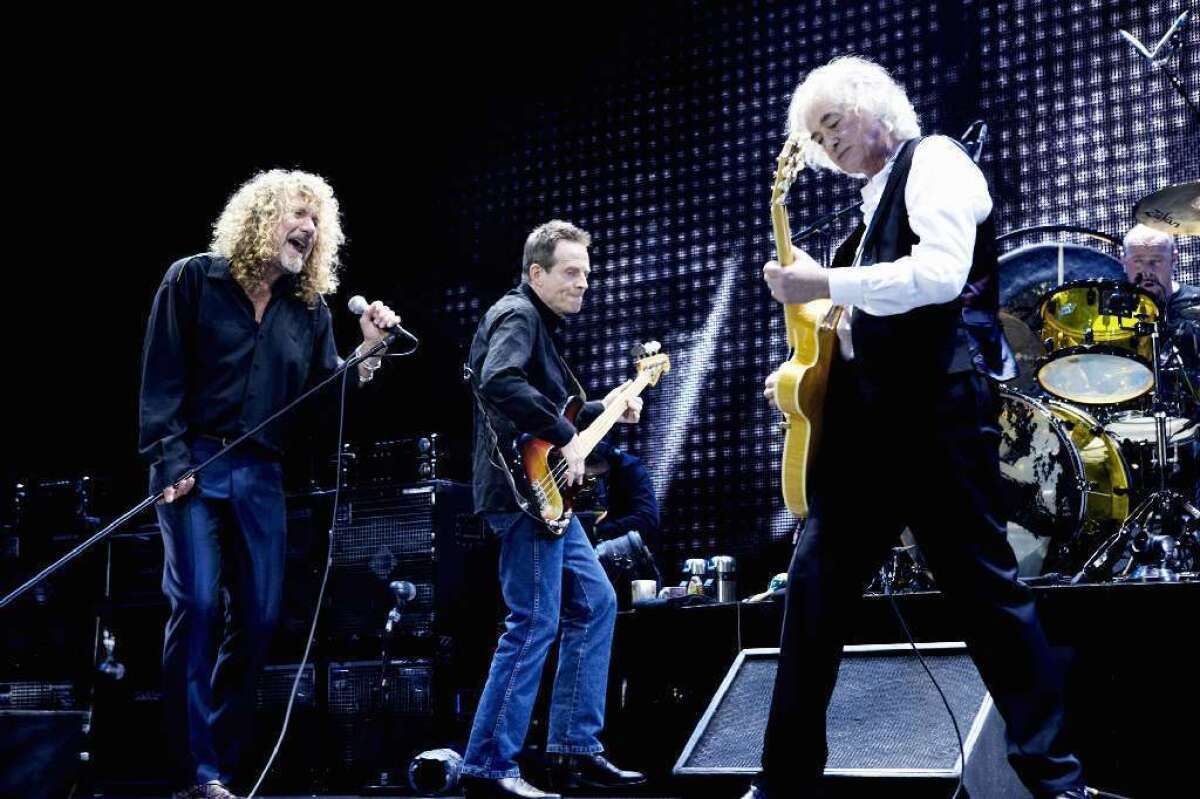 Robert Plant, from left, John Paul Jones and Jimmy Page, backed on drums by Jason Bonham, perform on stage during the Led Zeppelin Tribute to Ahmet Ertegun concert in 2007 in London.