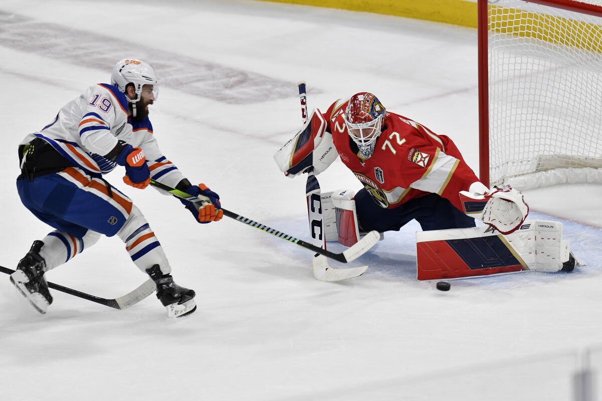Florida goaltender Sergei Bobrovsky stops a shot by Edmonton forward Adam Henrique.