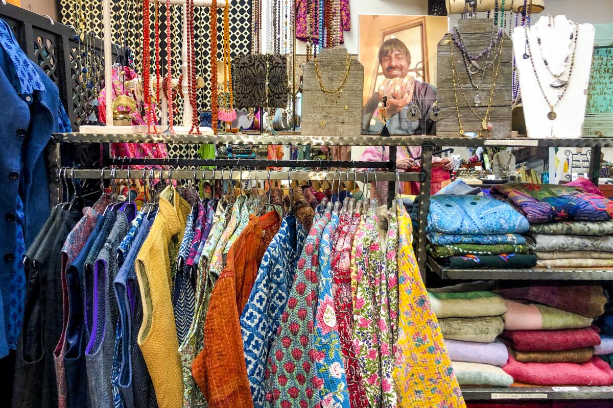 Colorful silk saris, jewelry, in a store 