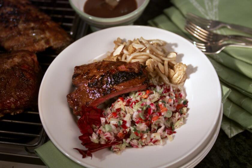 Recipe: Baby back ribs covered in a sweet Asian-style honey barbecue sauce.
