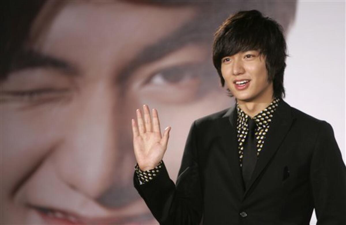 In this Dec. 14, 2009 photo, South Korean actor Lee Min-ho poses for media in Taipei, Taiwan. Lee, who shot to fame in Asia for his role in the 2009 hit television drama "Boys Over Flowers," has received a rousing welcome from Filipino fans in Manila. (AP Photo/Wally Santana)