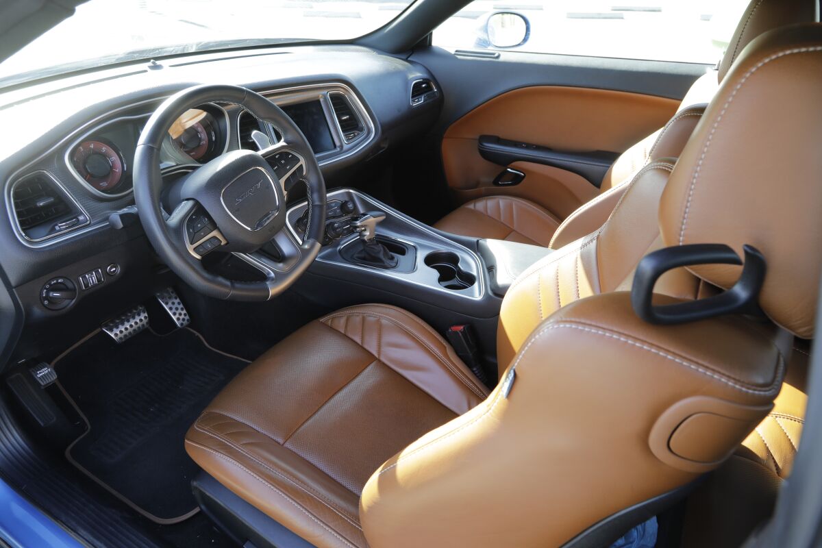 The interior of the Dodge Challenger Hellcat Redeye features an 8.4-inch touchscreen.