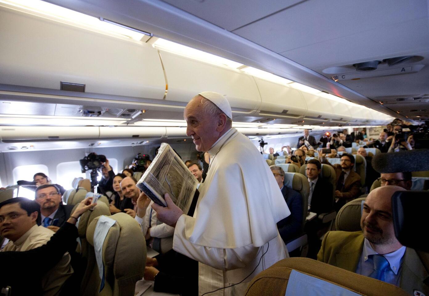 Pope Francis aboard the papal plane
