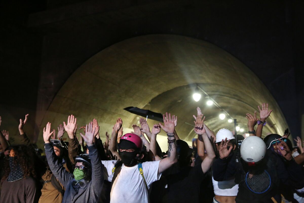 Protesters in the Third Street Tunnel on Wednesday in downtown Los Angeles after the shooting of Jacob Blake in Kenosha, Wis.