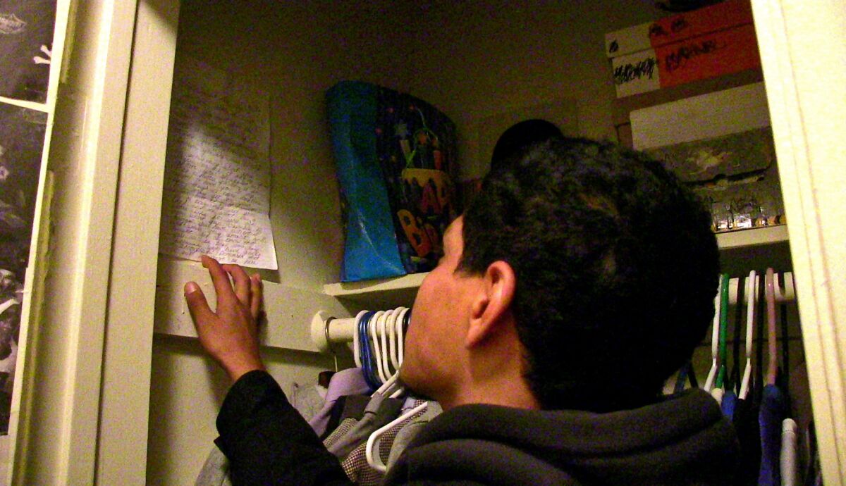 Hollywood Bernstein High defensive back Damian Sanchez examines a letter of support penned by his mother. "It makes me think everything will be fine," says Damian, 17. His mother's words: "I just want you to know that all your dad and me want is a better life for you."