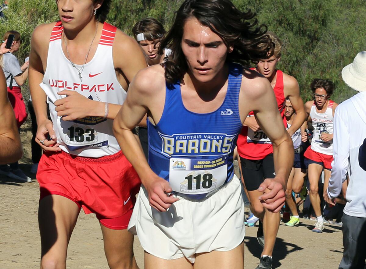 Fountain Valley's Luke Dias (118) runs up "Poop Out" hill in the boys' Division 1 race of the CIF finals on Saturday.