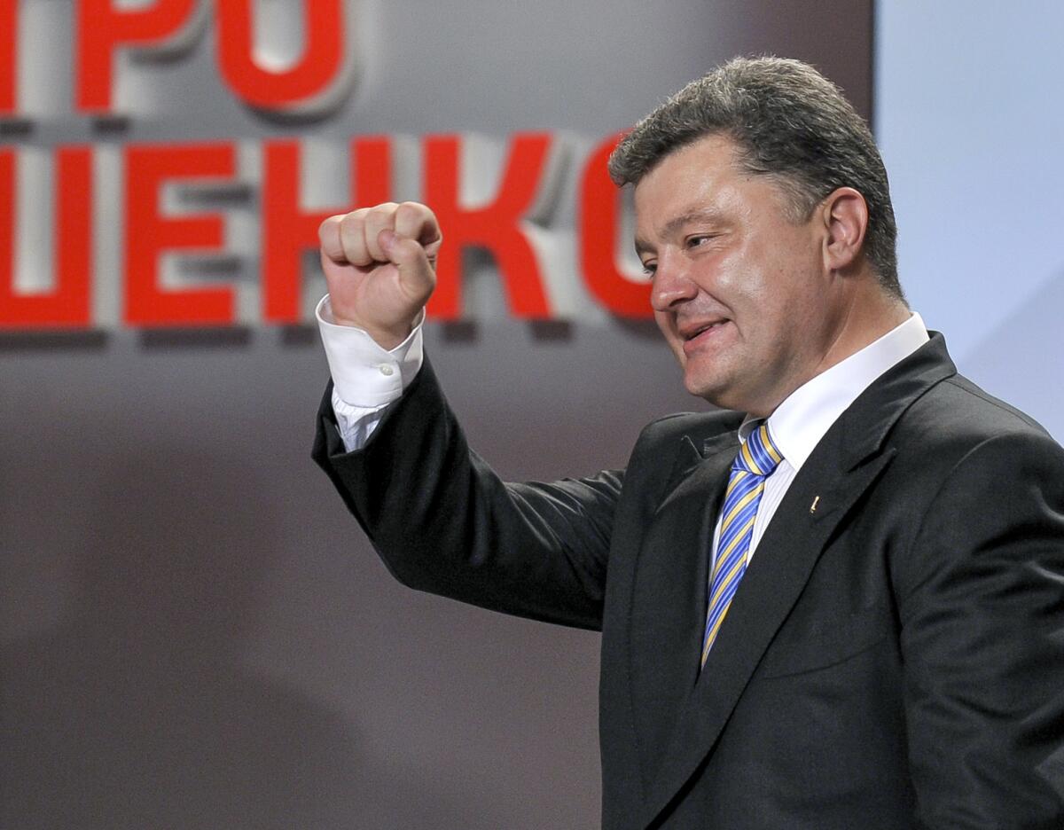 Ukrainian presidential candidate Petro Poroshenko appears triumphant in Kiev after exit polls showed him headed toward a first-round victory.