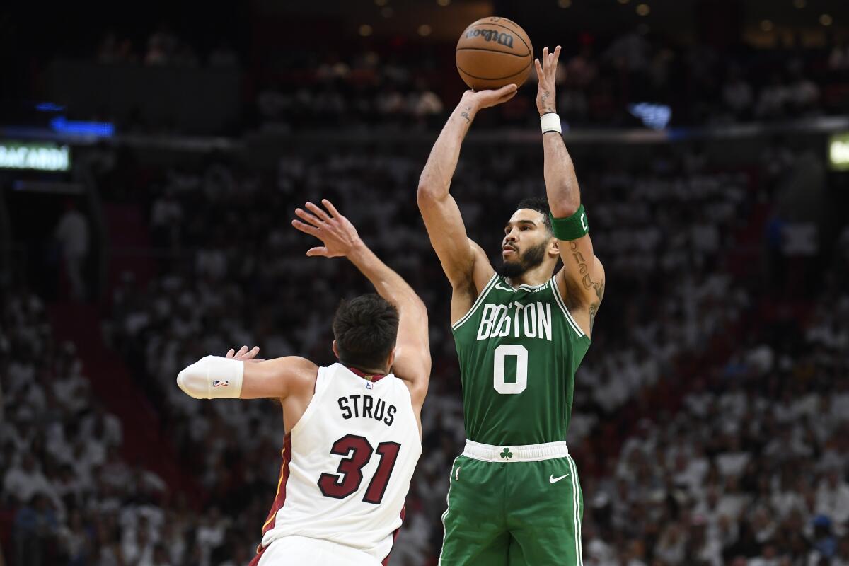 The Celtics' Jayson Tatum shoots over the Heat's Max Strus during the second half May 27, 2023.