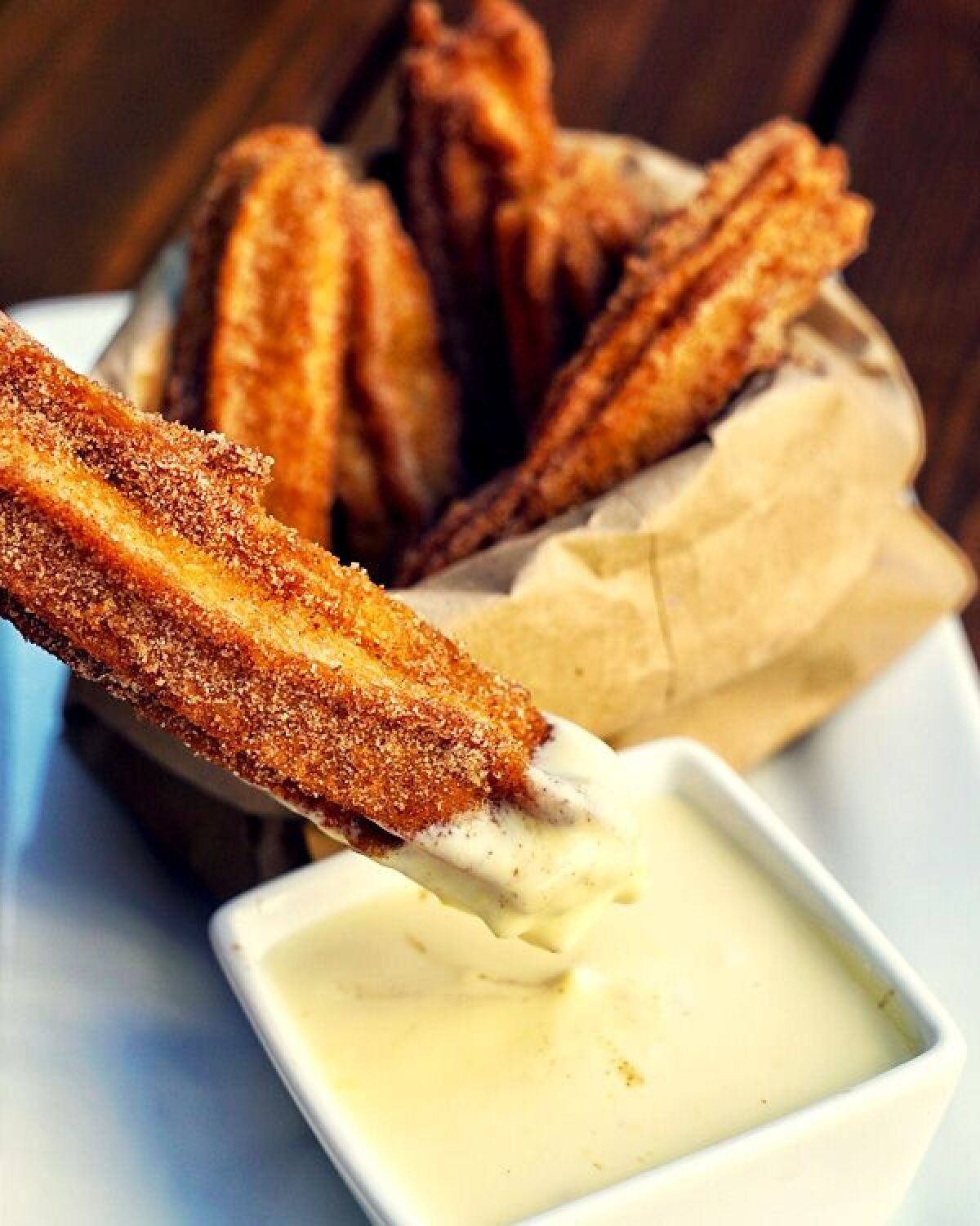 Blind burro makes gourmet churro dough with cinnamon water, then offers a creme Anglaise sauce for dipping.