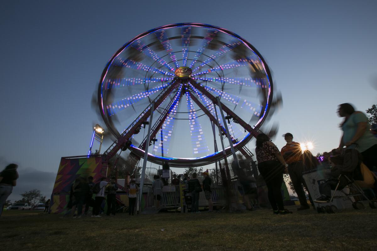 Guests ride the Ferris wheel during the Newport Harbor Lions Club's 70th annual fish fry in 2017.