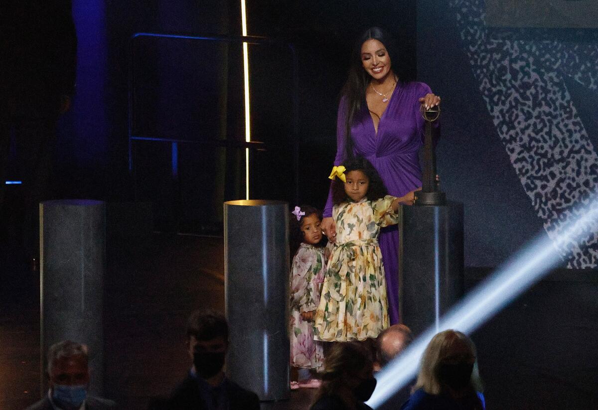 Vanessa Bryant stands with daughters Capri and Bianka after speaking on behalf of Kobe.