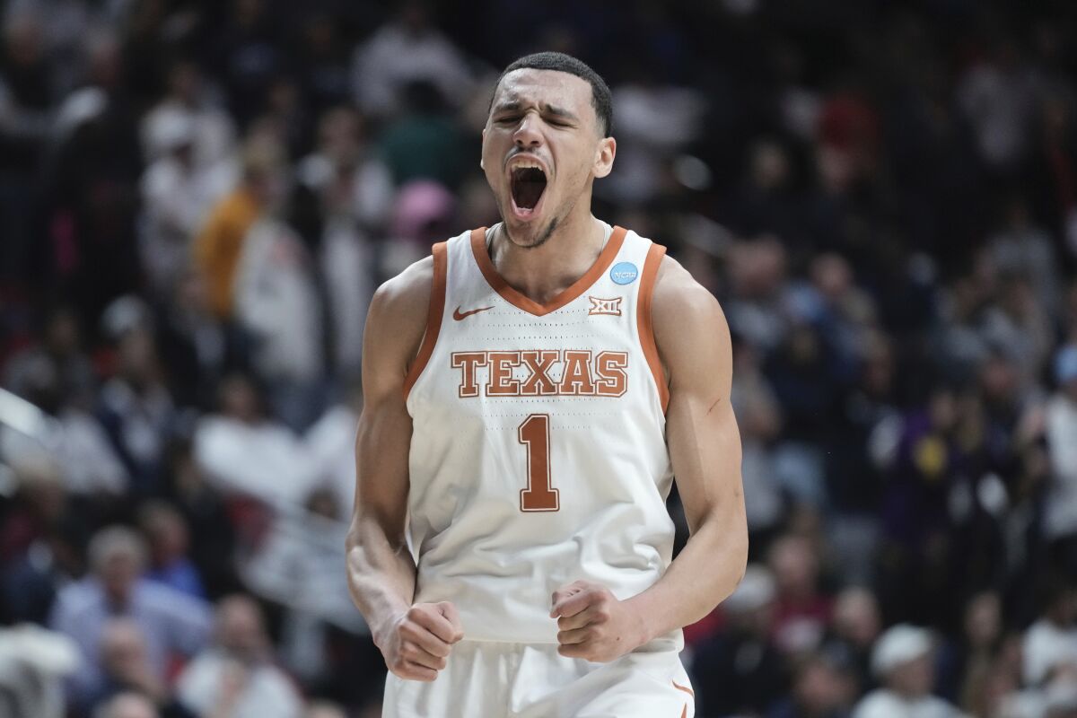 Texas' Dylan Disu celebrates during the final seconds of the second half of a second-round college basketball game in the NCAA Tournament Saturday, March 18, 2023, in Des Moines, Iowa. (AP Photo/Morry Gash)
