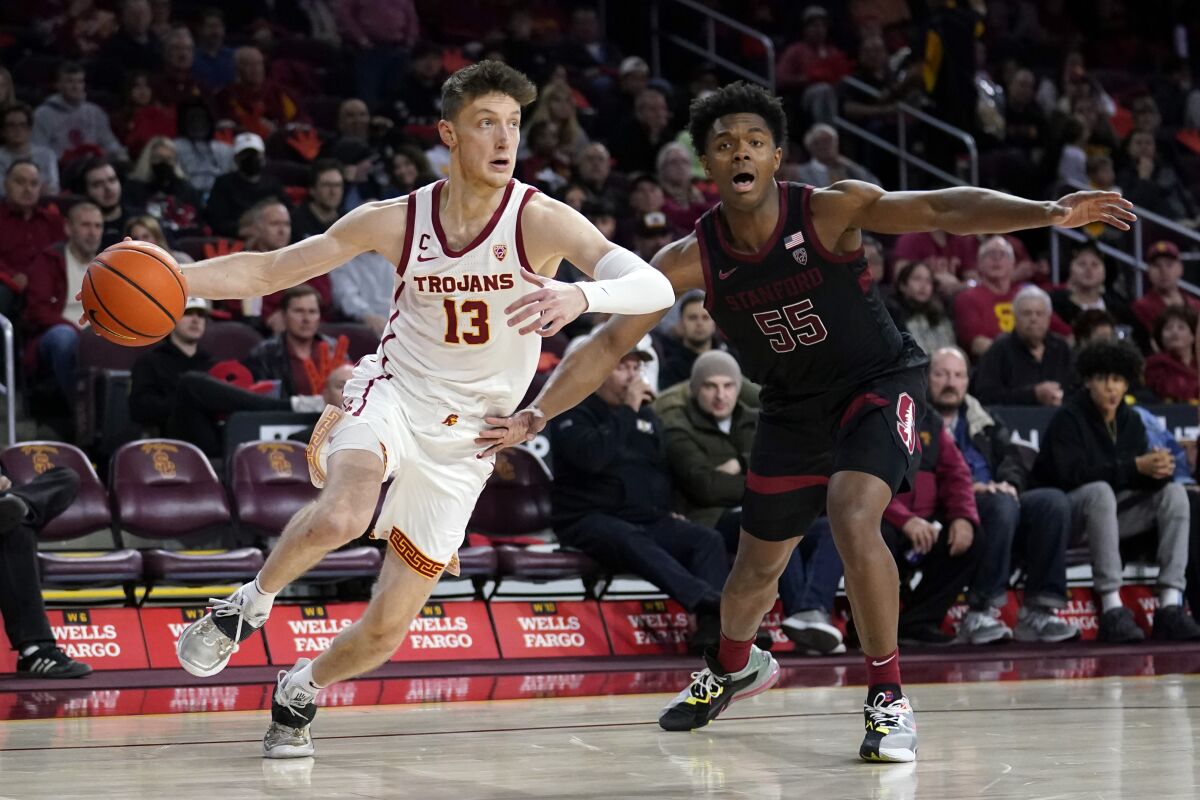 USC guard Drew Peterson, shown in a game in February against Stanford, has been slowed the last two weeks by a stiff back.