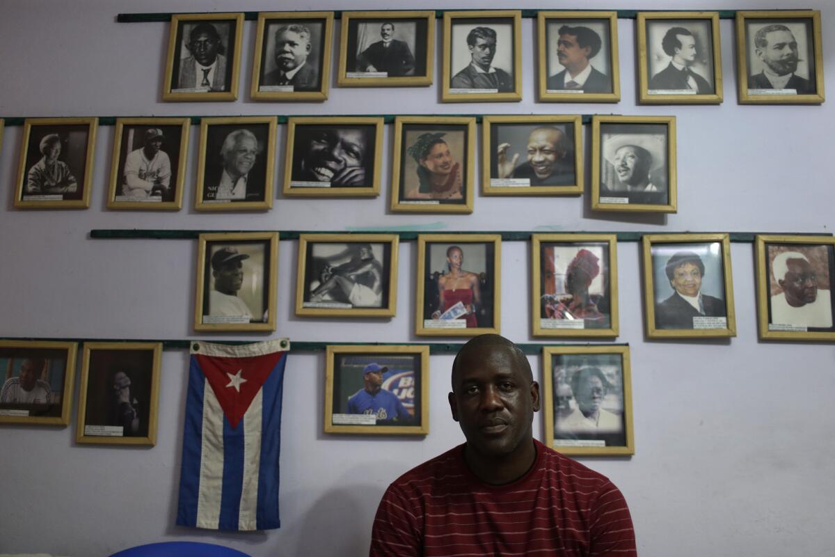 Juan Madrazo Luna displays a gallery of famous Afro-Cubans in his Havana home.