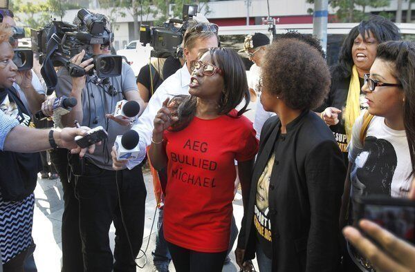 Michael Jackson fans from left, Karlene Taylor, Yvonne Francis, Latrenda White and Jamie Lee, speak out against AEG Live. A jury found Wednesday that AEG Live was not liable in the death of the pop superstar.
