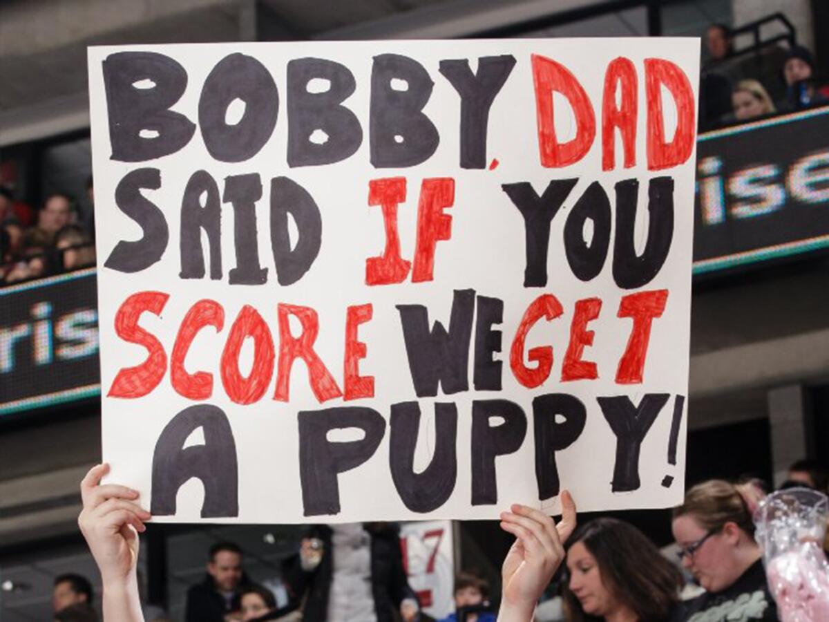 A young fan at a hockey game between the Ottawa Senators and New York Rangers holds up a sign for forward Bobby Ryan during a game on Jan. 24.